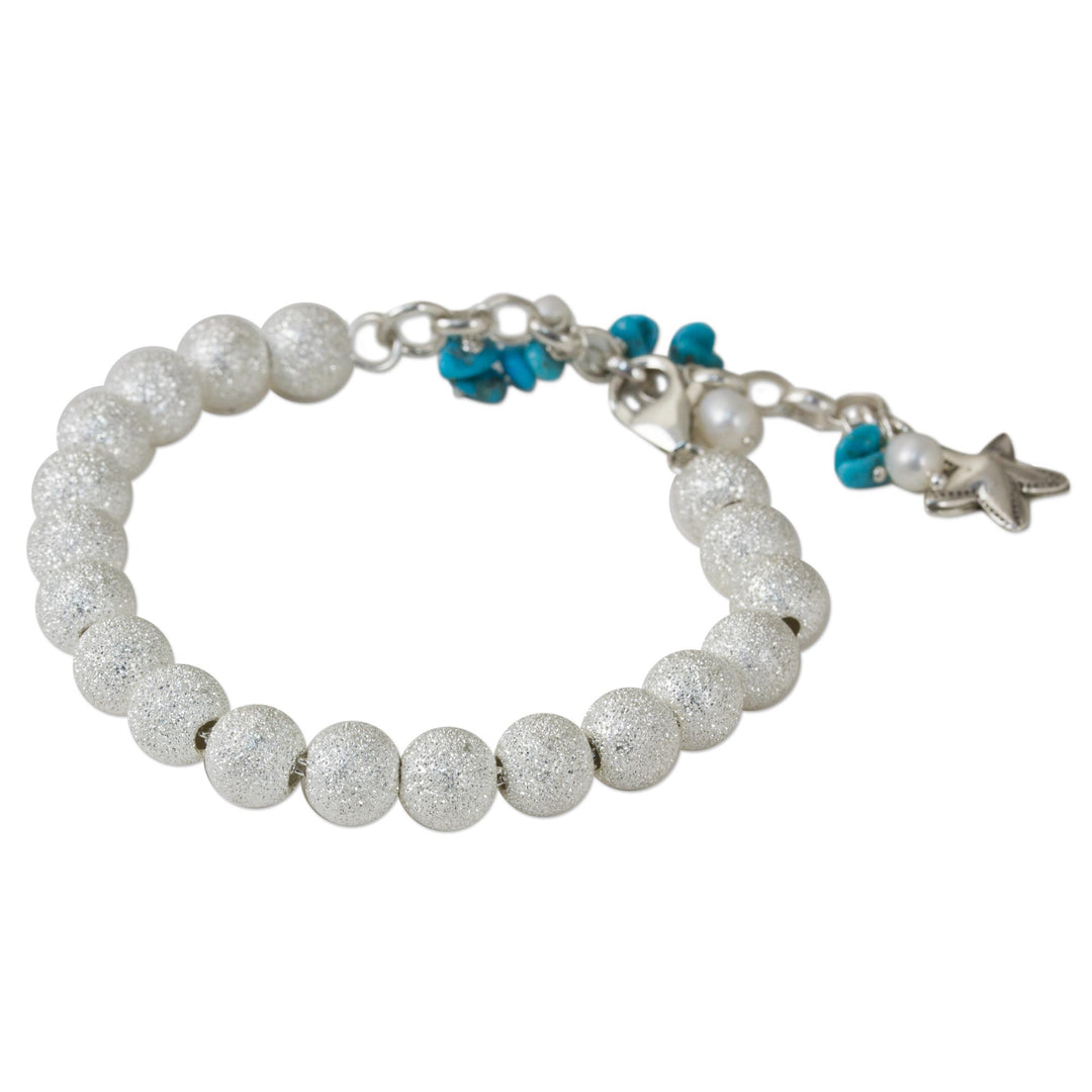 Artisan Crafted Silver Bracelet with Starfish Charm - Sparkling Waves