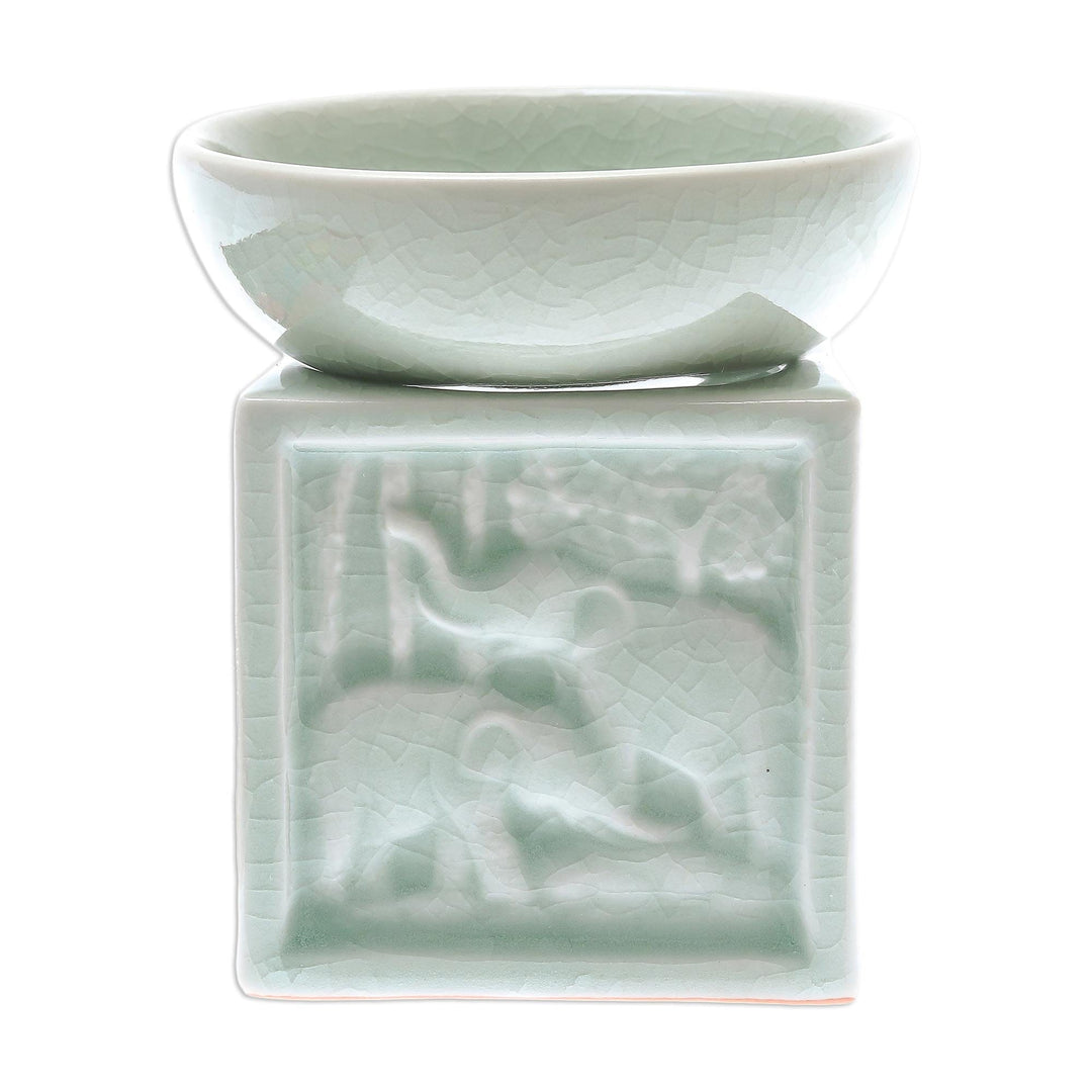 Elephant-Themed Celadon Ceramic Oil Warmer from Thailand - Elephant Jungle