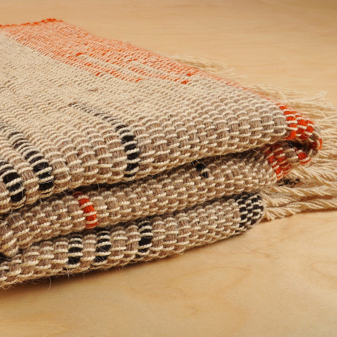 Handwoven Black and Orange Wool Area Rug (2.5x5) - Paths on Beige