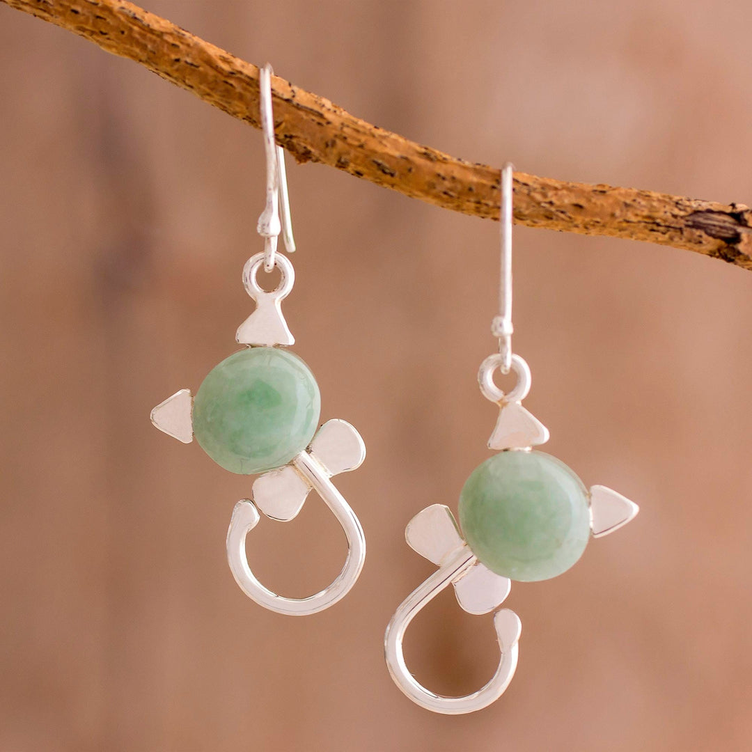 Small Felines in Light Green