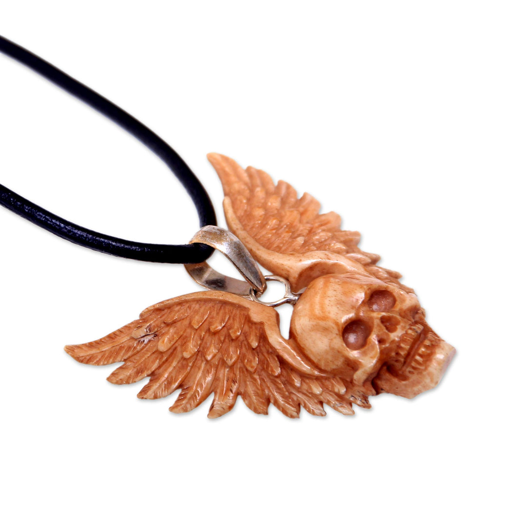Hand Carved Bone Pendant Necklace of a Skull from Indonesia - Flying Skull