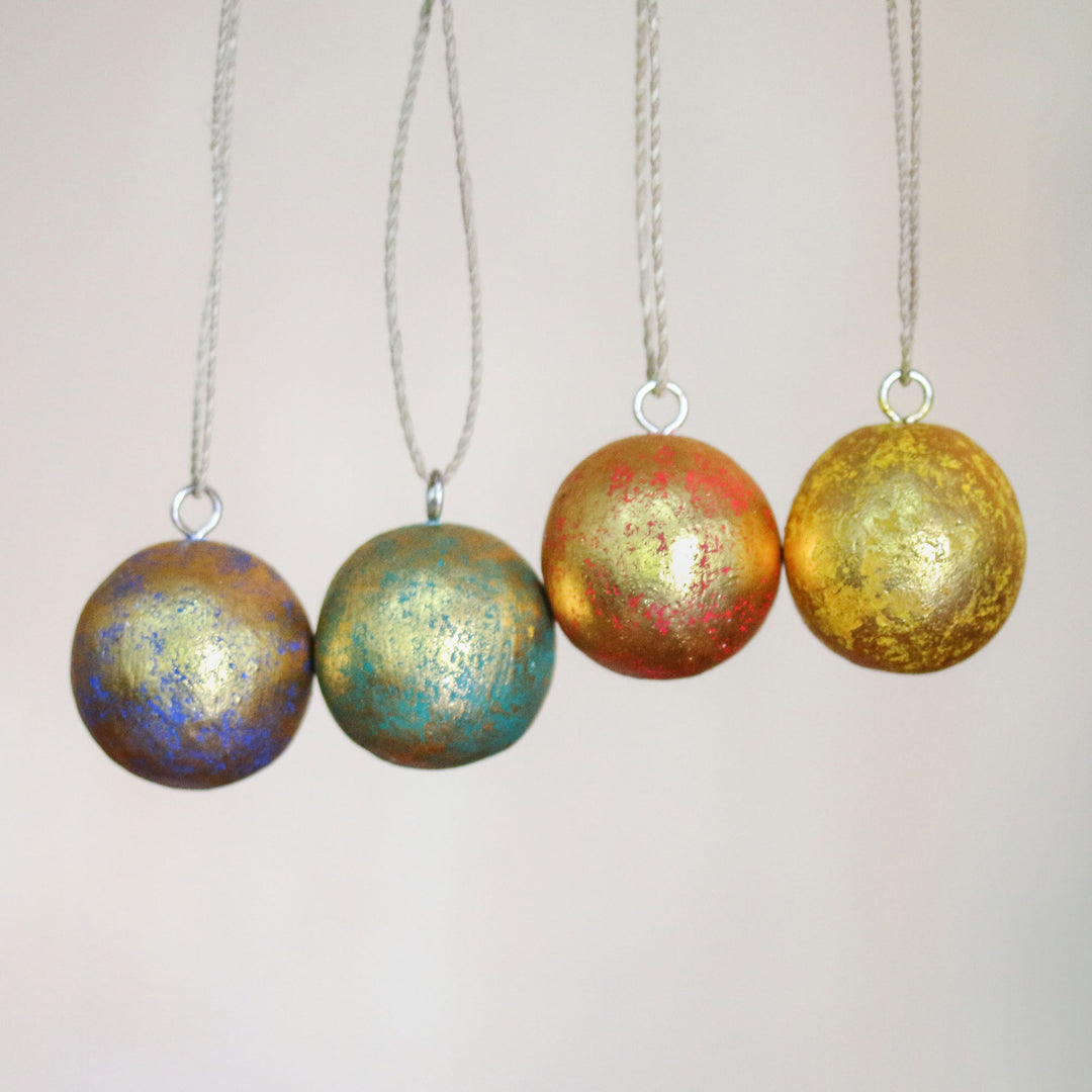 Four Round Gold Tone Albesia Wood Ornaments from Bali - Golden Baubles