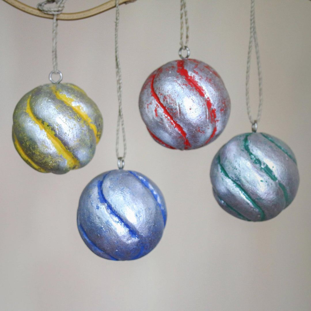 Four Round Silver Tone Albesia Wood Ornaments from Bali - Festive Spirals