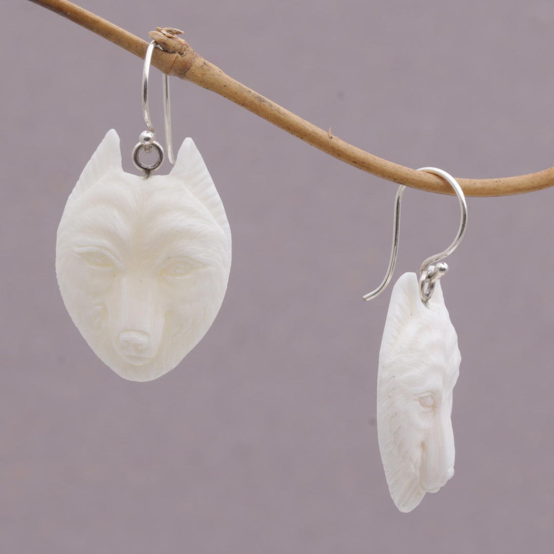 Handcrafted Bone Wolf Head Dangle Earrings from Bali - Wolf Pack