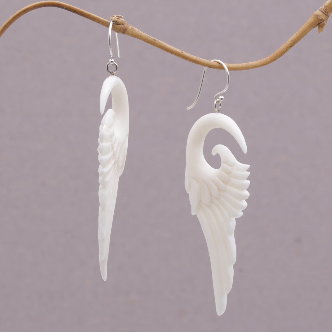 Handcrafted Bone Wing-Shaped Dangle Earrings from Bali - Swirling Wings