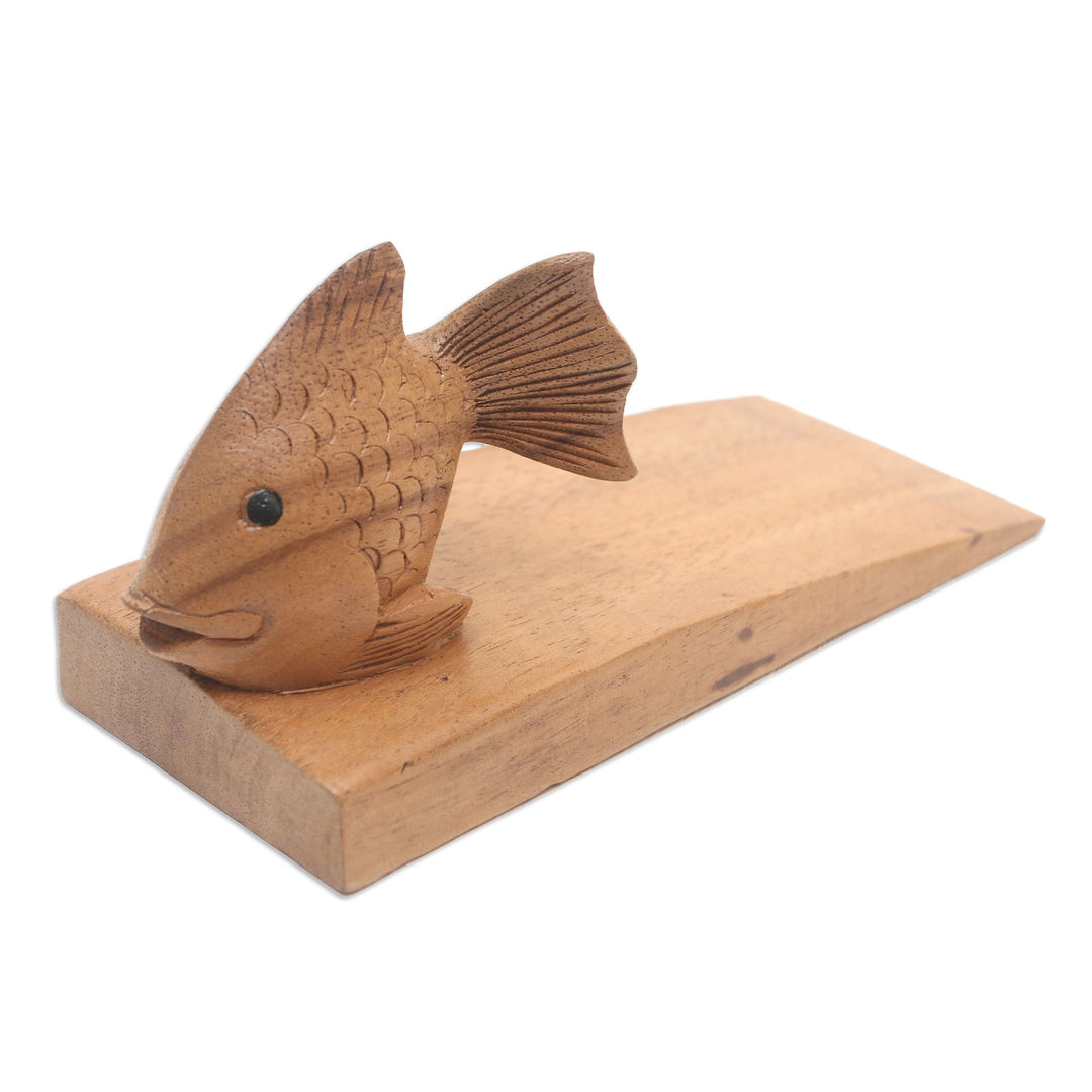 Handcrafted Suar Wood Fish Doorstop in Brown from Bali - Helpful Goldfish in Brown