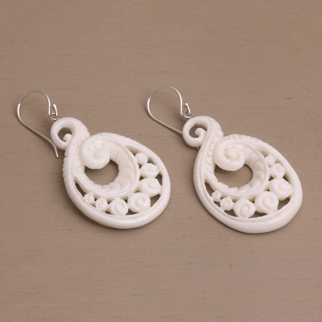 Handcrafted Bone Spiral Motif Dangle Earrings from Bali - Swirling Scales