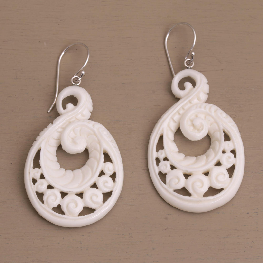 Handcrafted Bone Spiral Motif Dangle Earrings from Bali - Swirling Scales