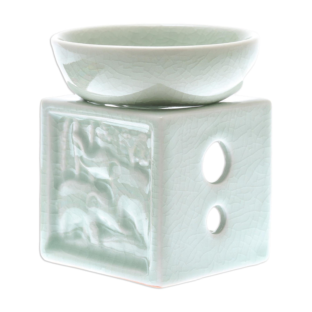 Elephant-Themed Celadon Ceramic Oil Warmer from Thailand - Elephant Jungle
