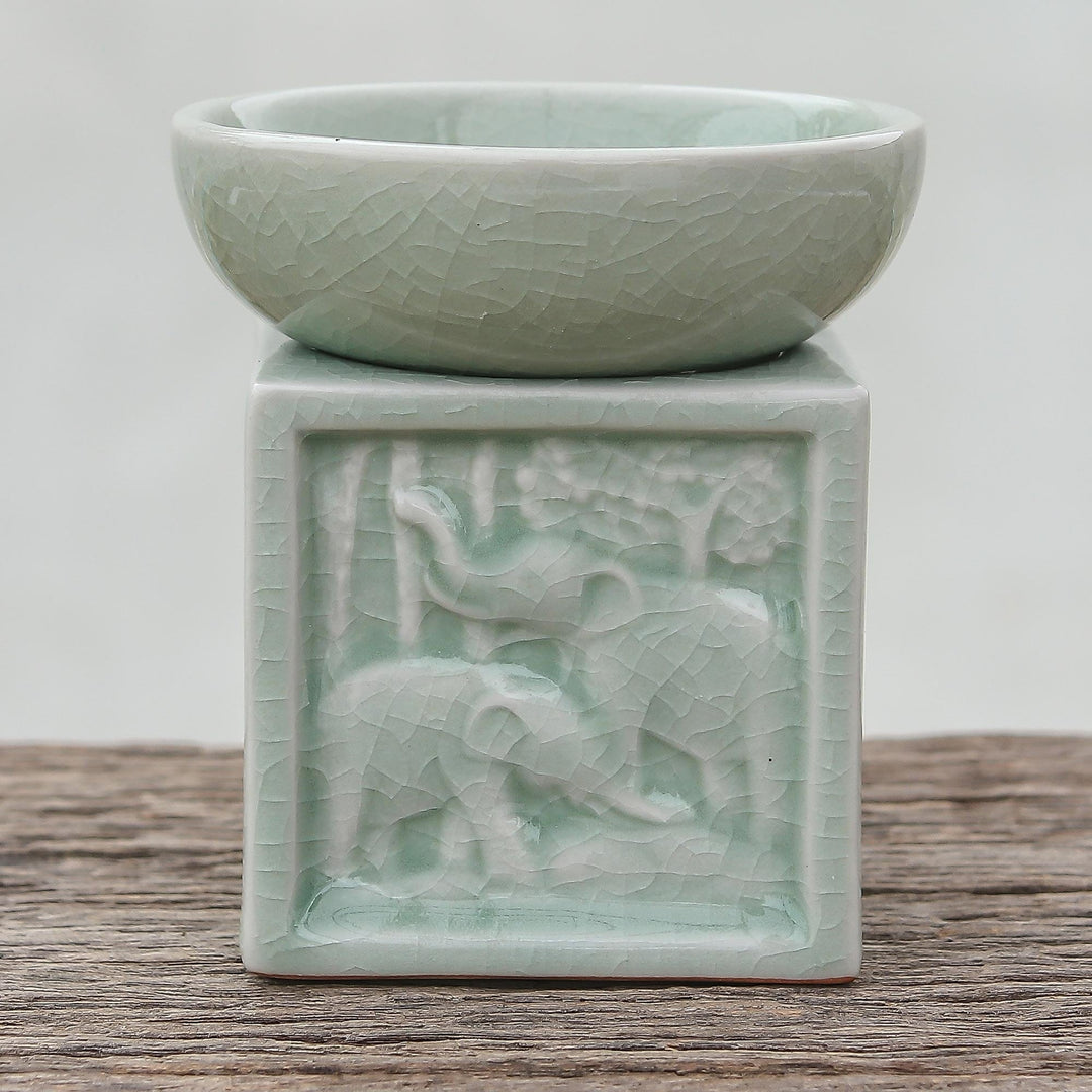 Elephant-Themed Celadon Ceramic Oil Warmer from Thailand - Elephant Jungle