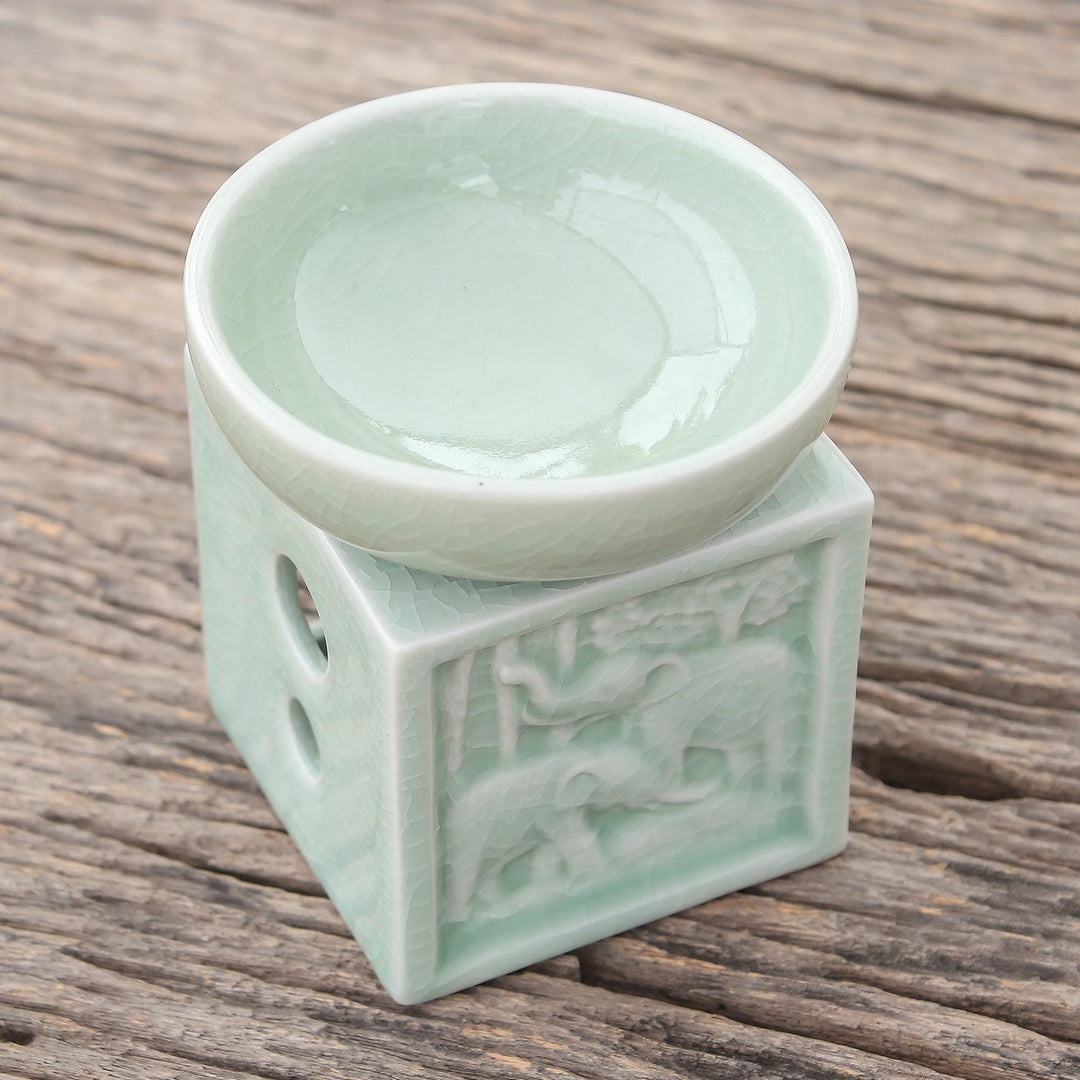 Elephant-Themed Celadon Ceramic Oil Warmer from Thailand - Elephant Jungle