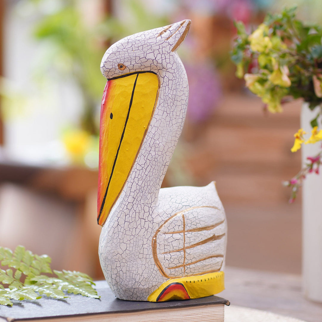 Hand Crafted Albesia Wood Pelican Statuette - Pelican Crossing in White