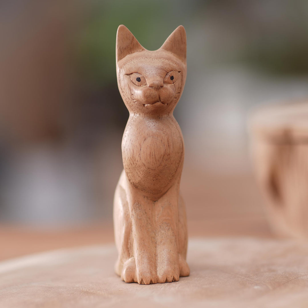 Brown Cat Sculpture Hand-Carved from Jempinis Wood in Bali - Cunning Cat