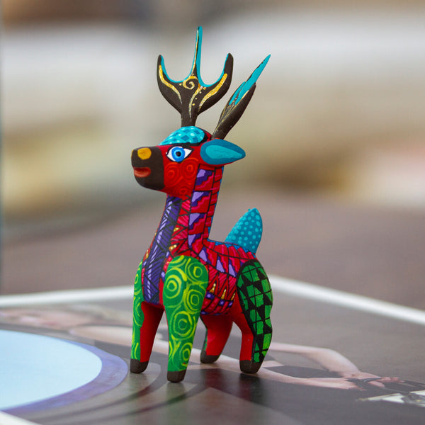 Copal Wood Alebrije Deer Figurine Painted in Crimson Hues