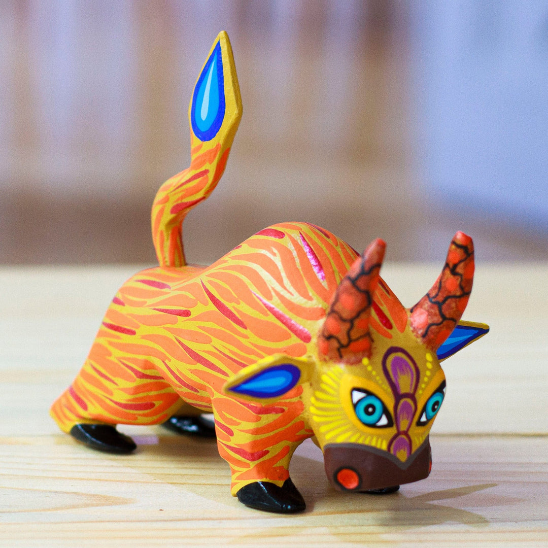 Hand-Painted Orange and Red Flaming Alebrije Bull Figurine - Flaming Force