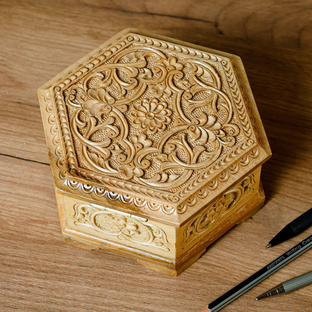 Jewelry box in store hexagonal shape with rich inlays of pearl and noble woods.