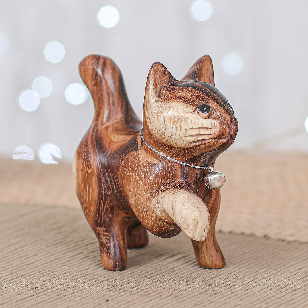 Hand-Carved Raintree Wood Happy Cat Figurine with Bell - Melodic Steps