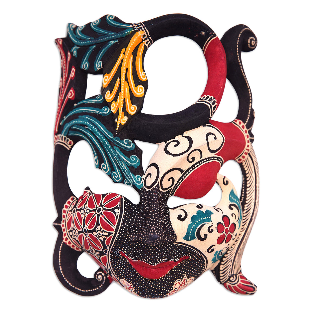 Handcrafted Nature-Themed Batik Pule Wood Mask from Java - Infinite Woman