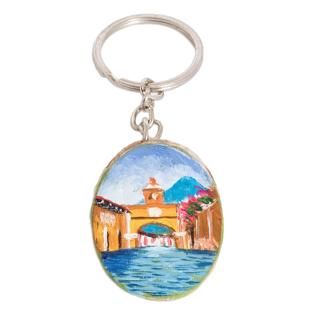 Hand-Carved Pinewood Keychain with Antigua's Arch Painting - Antigua's Charm