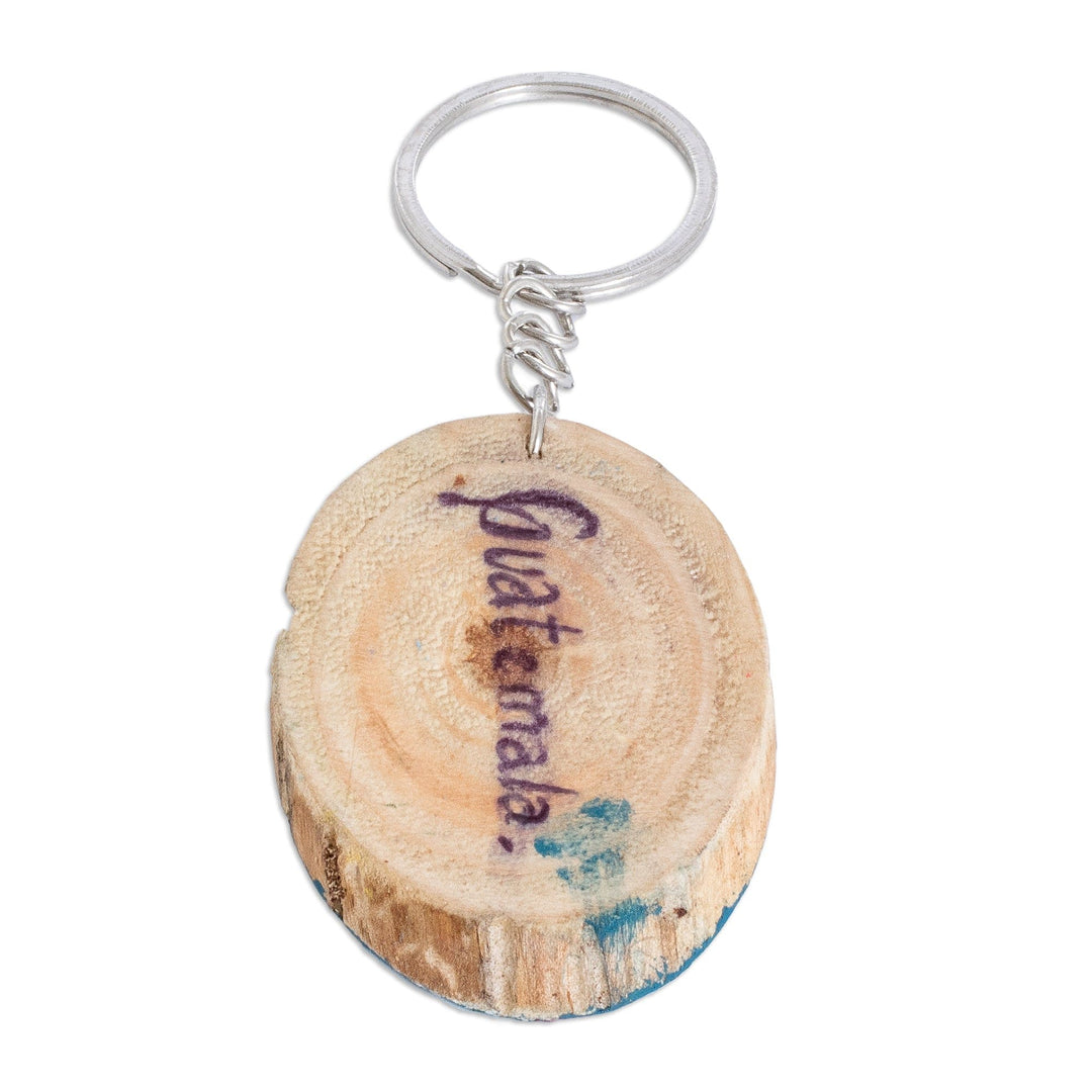 Hand-Carved Pinewood Keychain with Colorful Bird Painting - Nature Charm