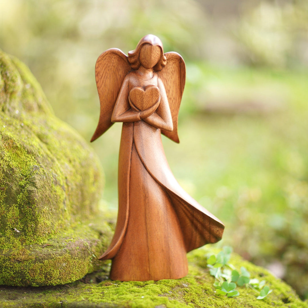 Angel and Heart-Themed Suar Wood Sculpture from Bali - Loving Archangel