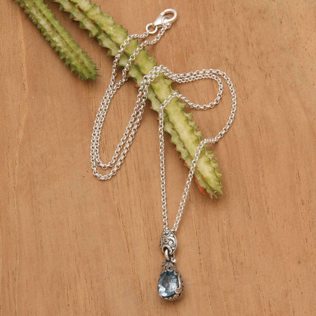 Silver Pendant Necklace with One-Carat Blue Topaz Gemstone - Bird Nest