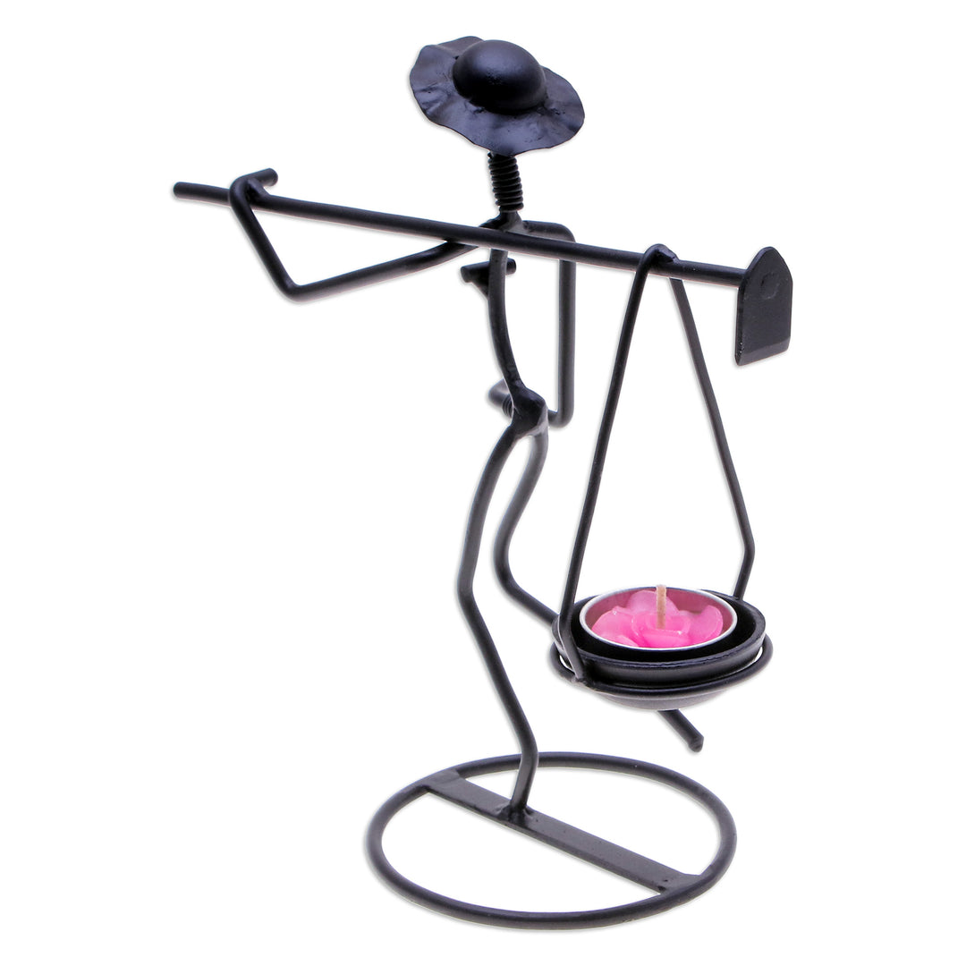 Modern Iron Tealight Holder of Man Carrying Weight in Black - On my Way