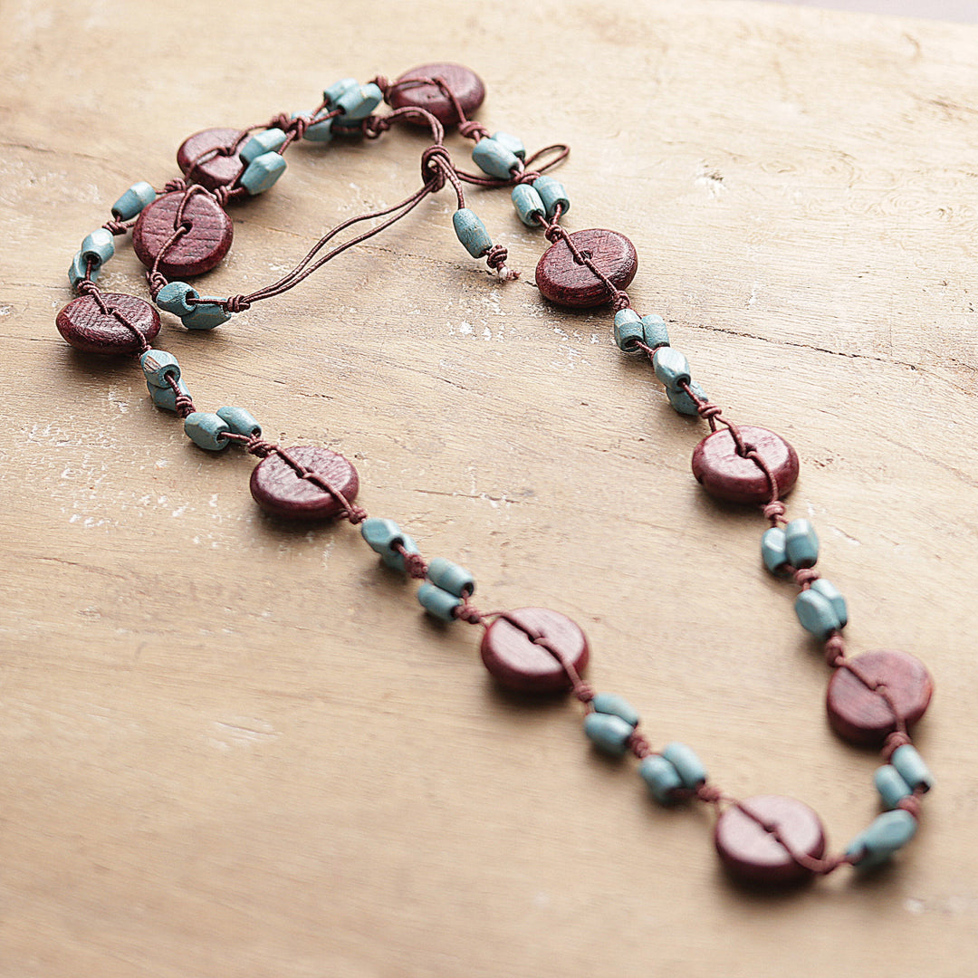 Hand-Carved Wood Beaded Long Necklace in Brown and Aqua Hues - Graceful Fusion