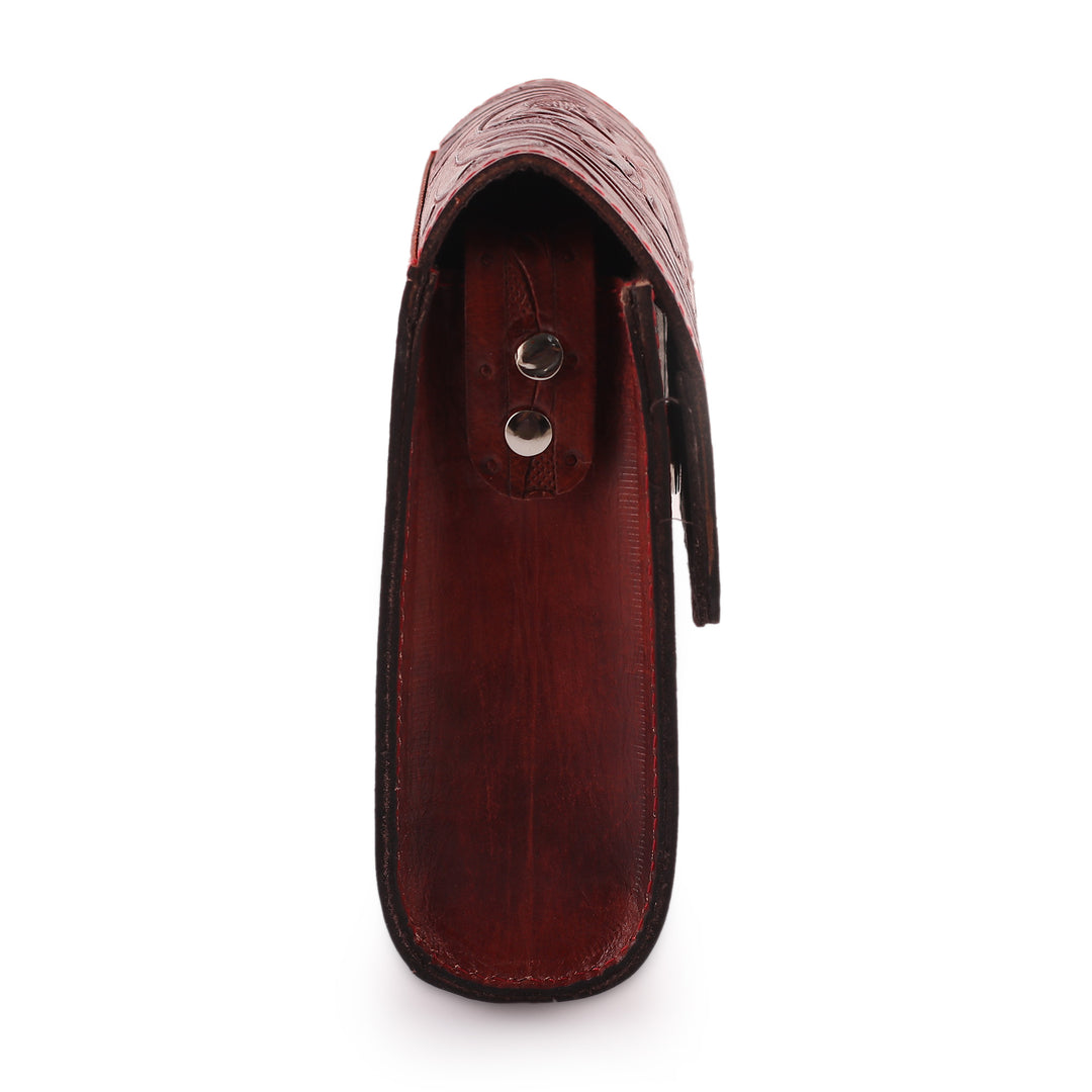 Red Leather Sling Bag with Embossed Floral and Paisley Motif - Timeless Elegance in Russet